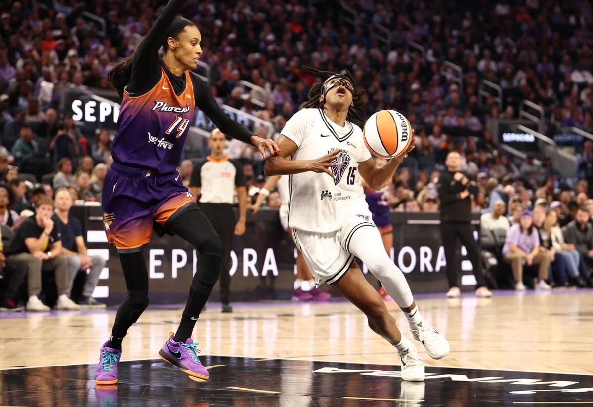 Jul 14, 2025; San Francisco, California, USA; Golden State Valkyries guard Tiffany Hayes (15) drives in against Phoenix Mercury guard DeWanna Bonner (14) during the second quarter at Chase Center. Mandatory Credit: Kelley L Cox-Imagn Images