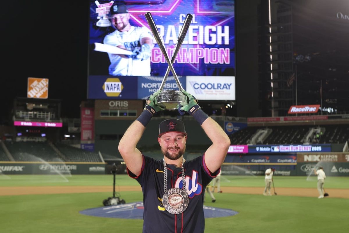 Jul 14, 2025; Atlanta, GA, USA; Seattle Mariners catcher Cal Raleigh (29) holds the trophy after winning the 2025 Home Run Derby at Truist Park. Mandatory Credit: Brett Davis-Imagn Images