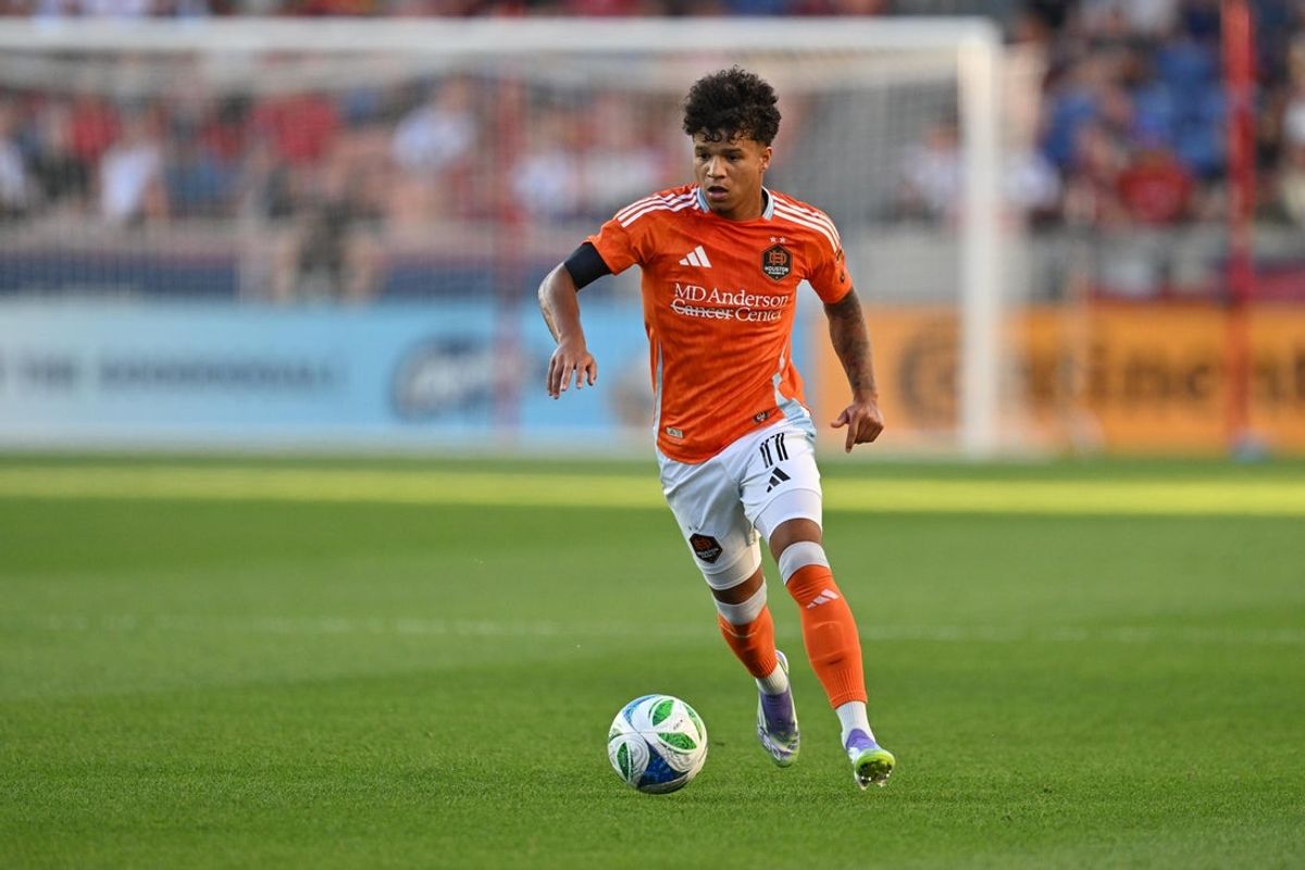 Jul 12, 2025; Sandy, Utah, USA;  Houston Dynamo FC forward Lawrence Ennali (11) controls the ball against Real Salt Lake at America First Field. Mandatory Credit: Jamie Sabau-Imagn Images