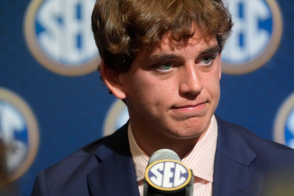 July 15, 2025; Atlanta, GA, USA; Texas quarterback Arch Manning listens to a question during SEC Media Days at the College Football Hall of Fame in Atlanta.