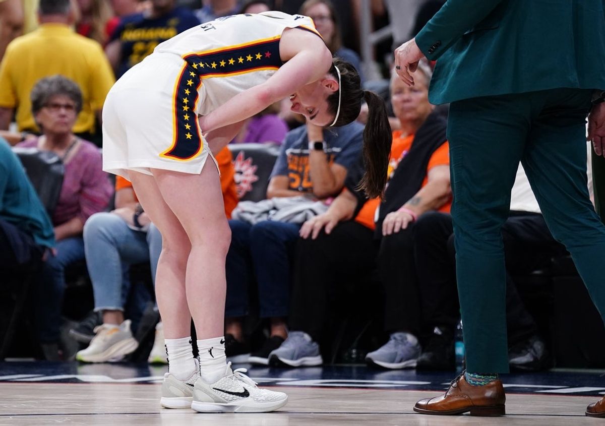 Jul 15, 2025; Boston, Massachusetts, USA; Indiana Fever guard Caitlin Clark (22) reacts with a possible injury after a play against the Connecticut Sun in the second half at TD Garden. Mandatory Credit: David Butler II-Imagn Images