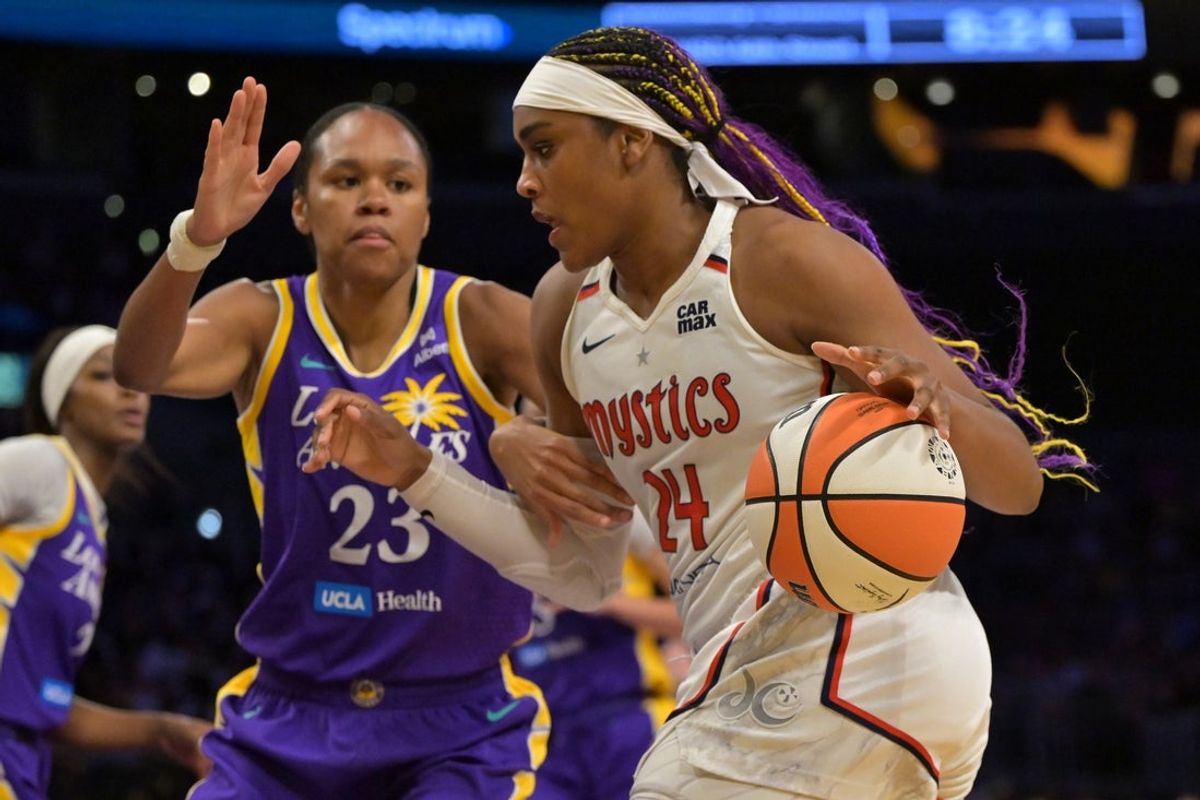 Jul 15, 2025; Los Angeles, California, USA; Washington Mystics forward Aaliyah Edwards (24) drives past Los Angeles Sparks forward Azura Stevens (23) during the second half at Crypto.com Arena. Mandatory Credit: Jayne Kamin-Oncea-Imagn Images