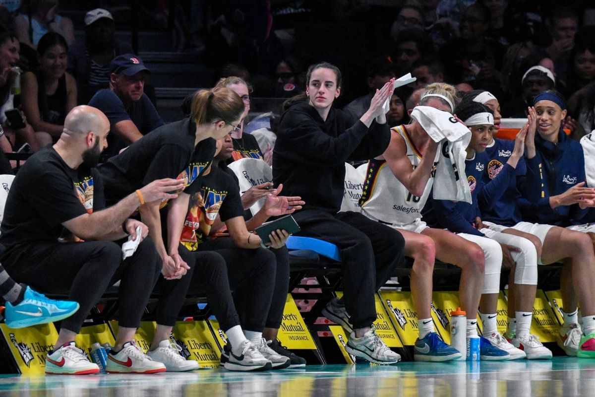 Jul 16, 2025; Brooklyn, New York, USA; Indiana Fever guard Caitlin Clark (22) reacts from the bench during the first half against the New York Liberty at Barclays Center. Mandatory Credit: John Jones-Imagn Images