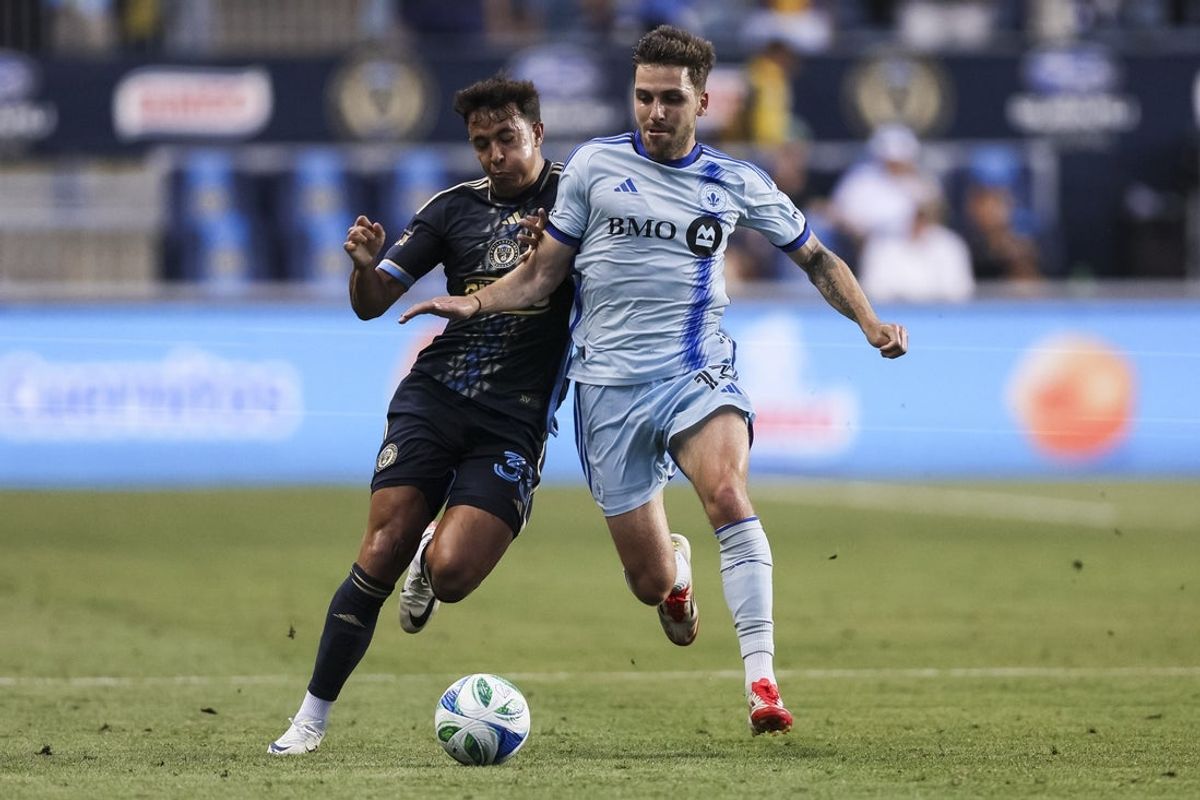 Jul 16, 2025; Chester, Pennsylvania, USA; Philadelphia Union midfielder Quinn Sullivan (33) and CF Montréal defender Luca Petrasso (13) battle for the ball during the first half at Subaru Park. Mandatory Credit: Caean Couto-Imagn Images