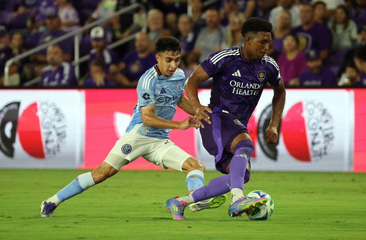 Jul 16, 2025; Orlando, Florida, USA; Orlando City SC defender Alex Freeman (30) defends  New York City FC forward Agustin Ojeda (26) during the first half at Inter&Co Stadium. Mandatory Credit: Kim Klement Neitzel-Imagn Images