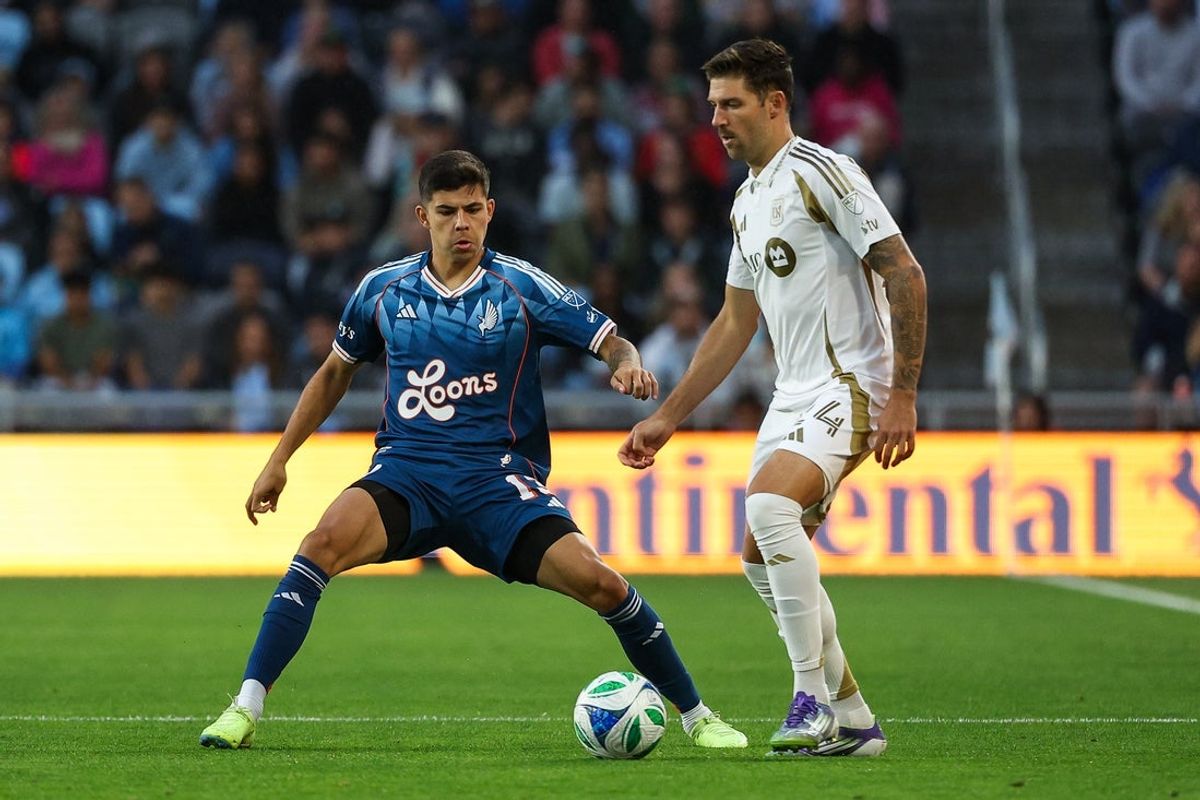 Jul 16, 2025; Saint Paul, Minnesota, USA; Minnesota United defender Anthony Markanich (13) defends against Los Angeles FC midfielder Ryan Hollingshead (24) during the first half at Allianz Field. Mandatory Credit: Matt Krohn-Imagn Images