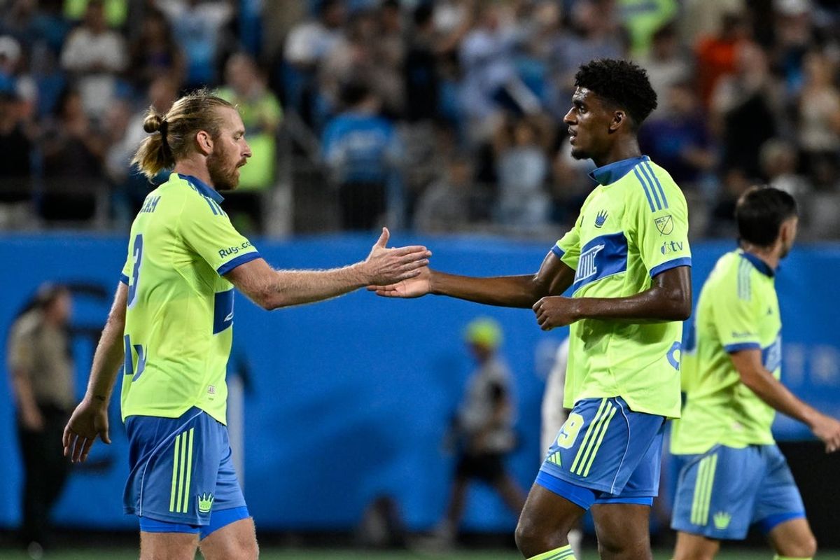Jul 16, 2025; Charlotte, North Carolina, USA;  Charlotte FC defender Tim Ream (3) with defender Adilson Malanda (29) after the match at Bank of America Stadium. Mandatory Credit: Bob Donnan-Imagn Images