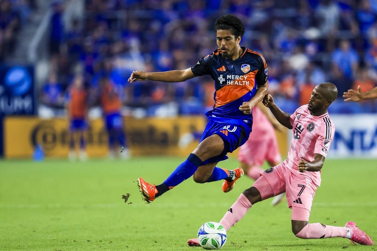 Jul 16, 2025; Cincinnati, Ohio, USA; FC Cincinnati midfielder Evander (10) battles for the ball against Inter Miami CF midfielder Fafa Picault (7) in the second half at TQL Stadium. Mandatory Credit: Katie Stratman-Imagn Images