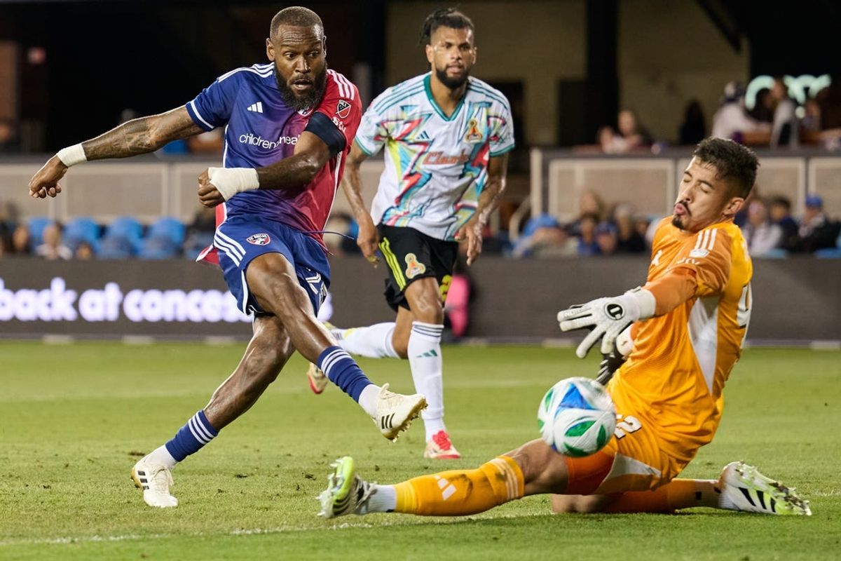Jul 16, 2025; San Jose, California, USA; FC Dallas defender Sebastien Ibeagha (25) shoots the ball against San Jose Earthquakes goalkeeper Daniel (42) during the second half at PayPal Park. Mandatory Credit: Robert Edwards-Imagn Images