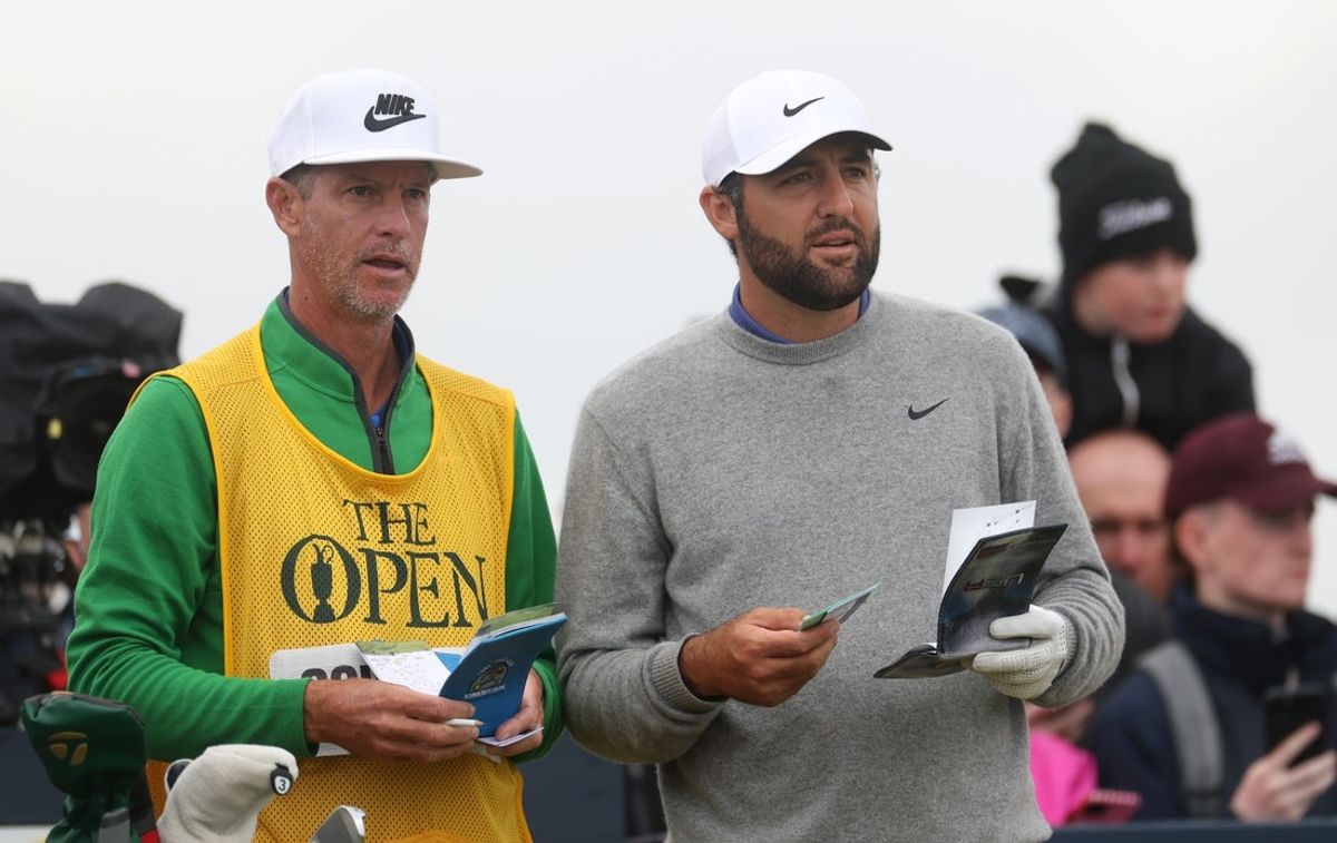 Jul 17, 2025; Portrush, IRL; Scottie Scheffler talks to his caddie Ted Scott on the 15th hole during the first round of The 153rd Open Championship golf tournament at Royal Portrush. Mandatory Credit: Mike Frey-Imagn Images