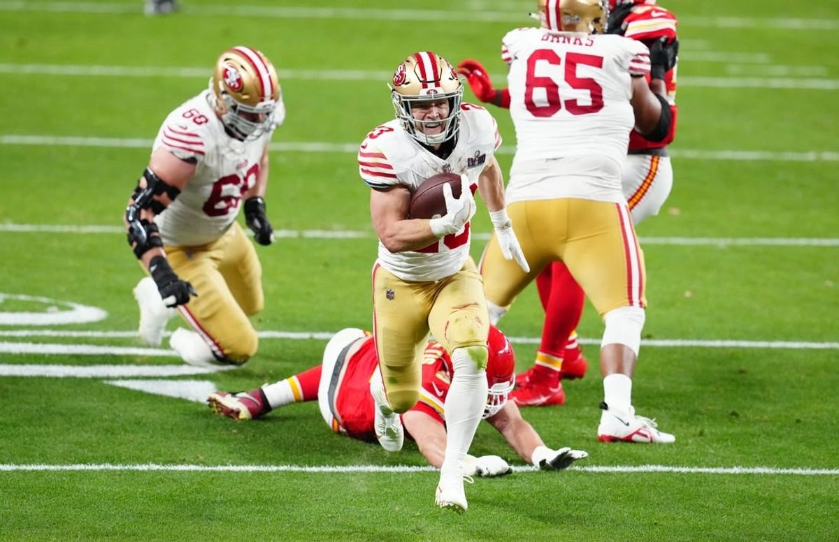 Feb 11, 2024; Paradise, Nevada, USA; San Francisco 49ers running back Christian McCaffrey (23) scores a touchdown against the Kansas City Chiefs in the first half in Super Bowl LVIII at Allegiant Stadium.