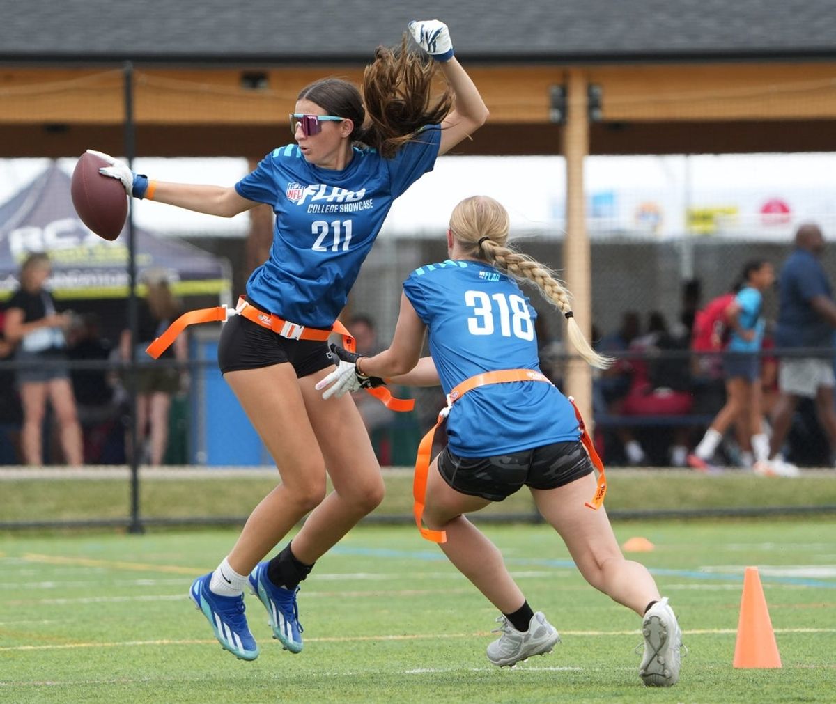 High school players take part in a girls flag football skills camp, Thursday, July 17, 2025, in Canton.