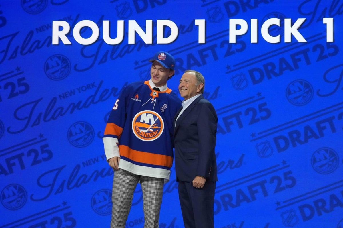 Jun 27, 2025; Los Angeles, California, USA; Matthew Schaefer (left) with NHL commissioner Gary Bettman after being selected as the first overall pick to the New York Islanders in the first round of the 2025 NHL Draft at Peacock Theater. Mandatory Credit: Kirby Lee-Imagn Images