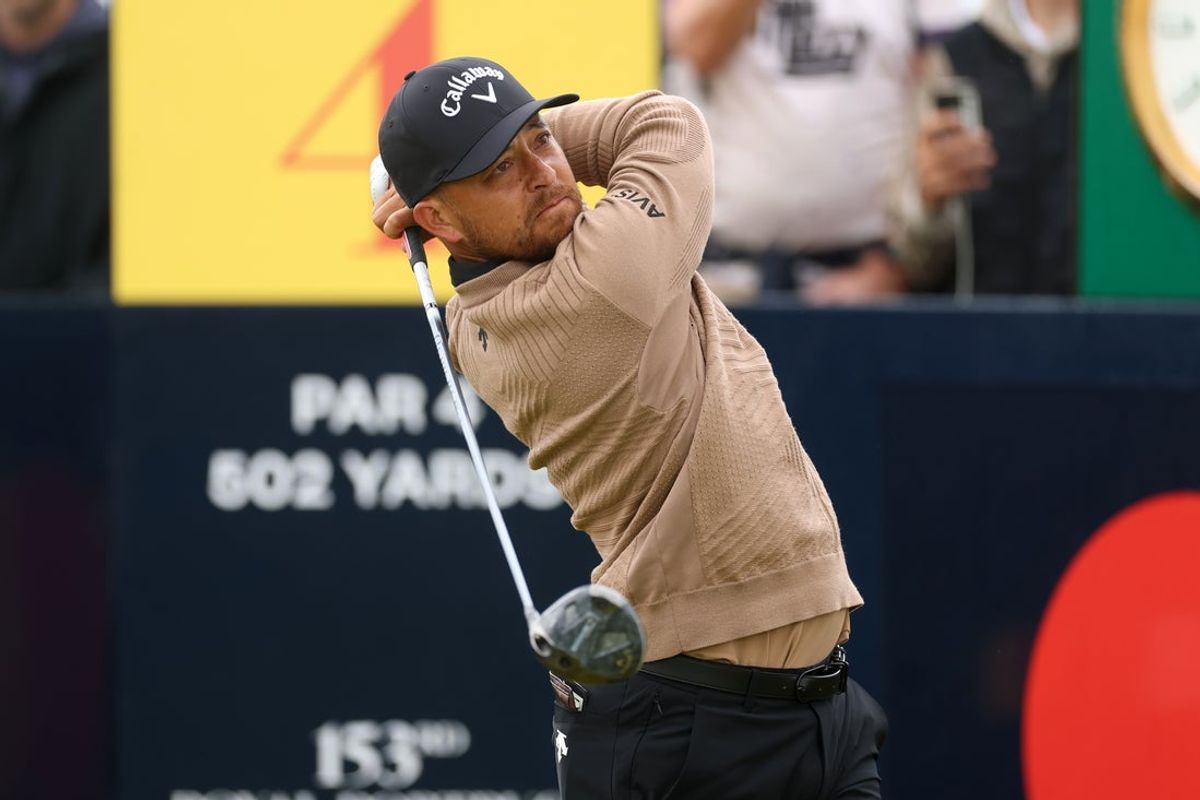 Jul 17, 2025; Portrush, IRL; Xander Schauffele hits a shot on the 4th hole during the first round of The 153rd Open Championship golf tournament at Royal Portrush. Mandatory Credit: Mike Frey-Imagn Images