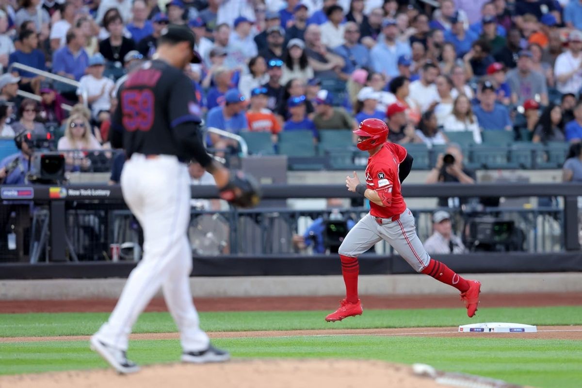 Jul 18, 2025; New York City, New York, USA; Cincinnati Reds left fielder Austin Hays (12) rounds the bases after hitting a solo home run off New York Mets starting pitcher Sean Manaea (59) during the fourth inning at Citi Field. Mandatory Credit: Brad Penner-Imagn Images