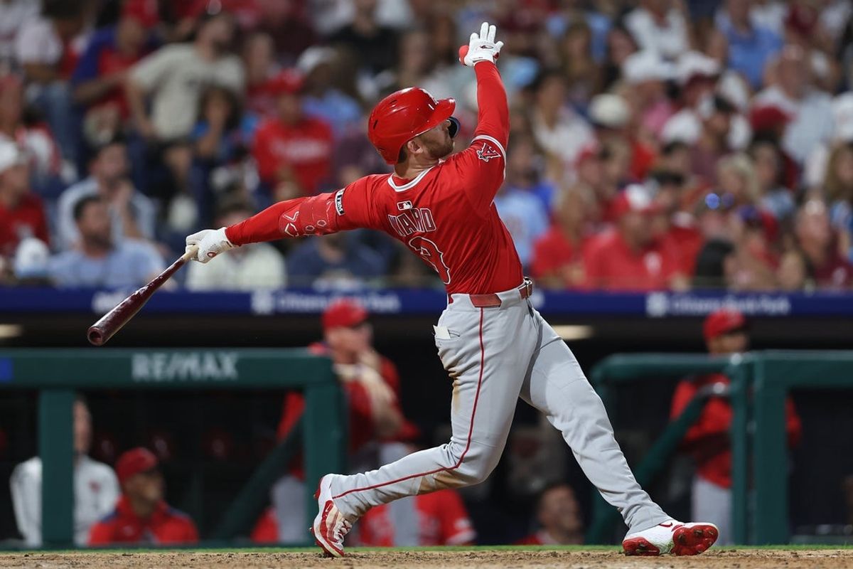 Jul 18, 2025; Philadelphia, Pennsylvania, USA; Los Angeles Angels outfielder Taylor Ward (3) hits a two RBI  home run against the Philadelphia Phillies during the seventh inning at Citizens Bank Park. Mandatory Credit: Bill Streicher-Imagn Images