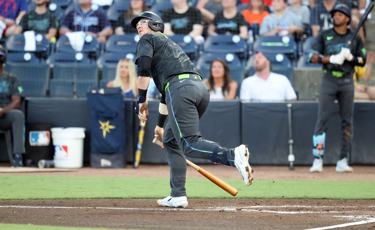 Jul 21, 2025; St. Petersburg, Florida, USA;  Tampa Bay Rays catcher Danny Jansen (19) hits a home run against the Baltimore Orioles during the second inning at George M. Steinbrenner Field. Mandatory Credit: Kim Klement Neitzel-Imagn Images