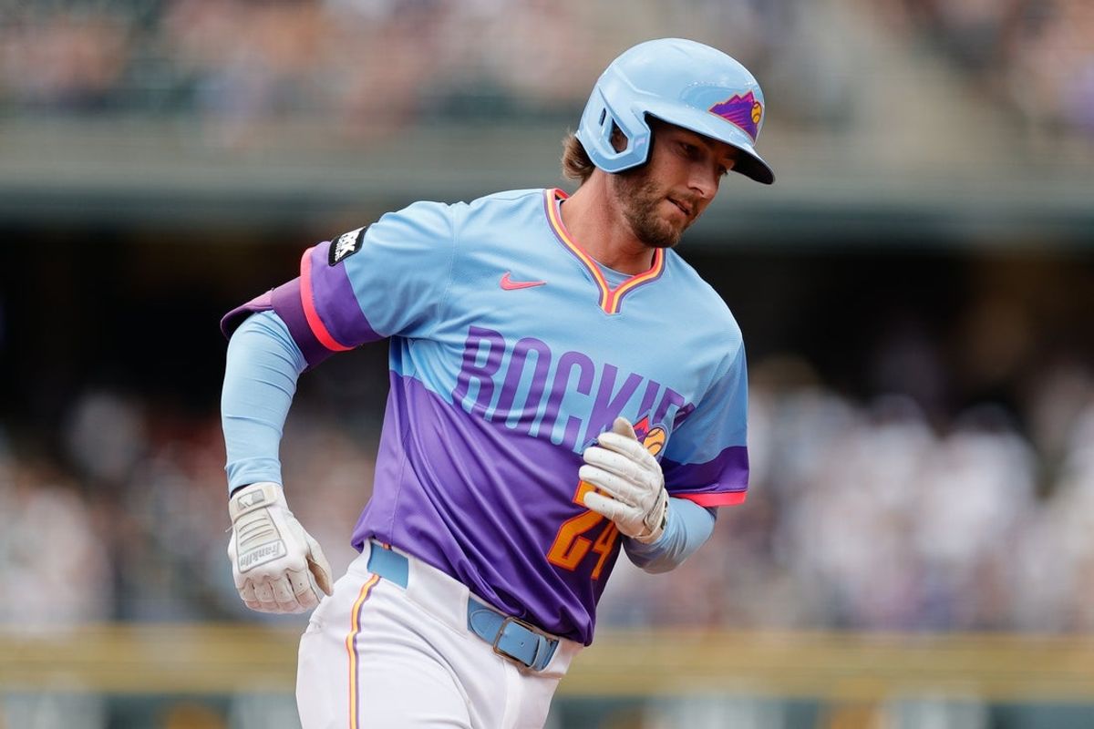 Jul 18, 2025; Denver, Colorado, USA; Colorado Rockies third baseman Ryan McMahon (24) rounds the bases on a two run home run in the first inning against the Minnesota Twins at Coors Field. Mandatory Credit: Isaiah J. Downing-Imagn Images