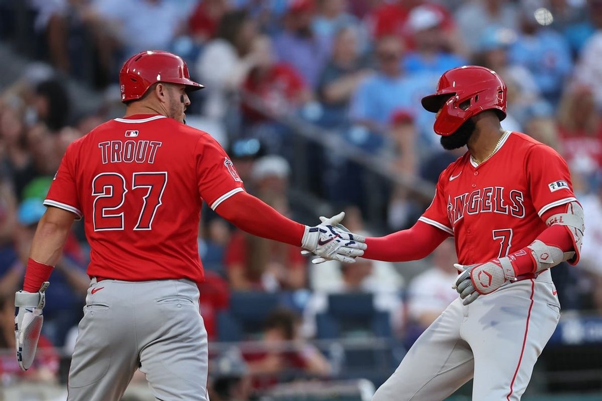 Jul 18, 2025; Philadelphia, Pennsylvania, USA; Los Angeles Angels outfielder Jo Adell (7) celebrates with outfielder Mike Trout (27) after hitting a two RBI home run against the Philadelphia Phillies during the fourth inning at Citizens Bank Park. Mandatory Credit: Bill Streicher-Imagn Images