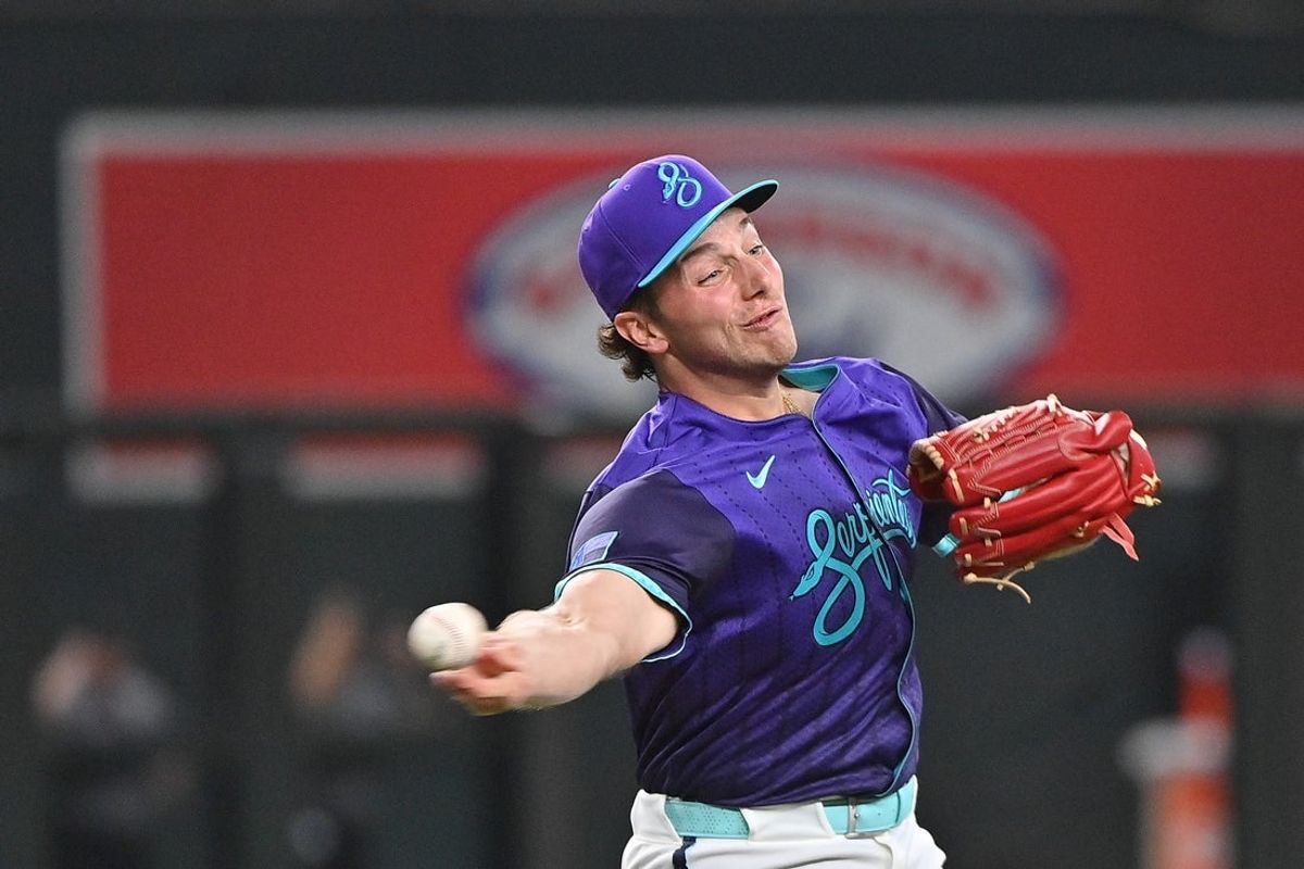 Jul 18, 2025; Phoenix, Arizona, USA; Arizona Diamondbacks pitcher Brandon Pfaadt (32) fields a bunt and throws to first base in the first inning against the St. Louis Cardinals at Chase Field. Mandatory Credit: Matt Kartozian-Imagn Images