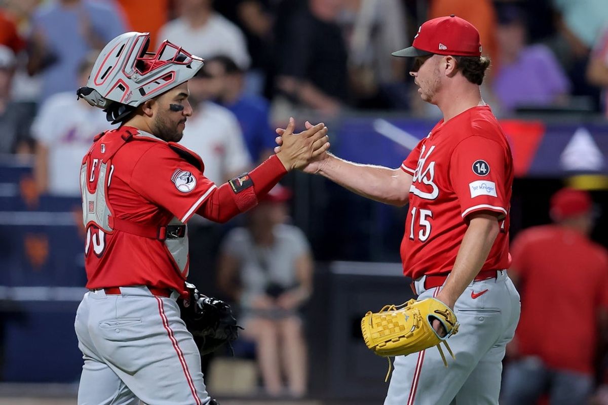 Jul 18, 2025; New York City, New York, USA; Cincinnati Reds catcher Jose Trevino (35) and relief pitcher Emilio Pagan (15) celebrate after defeating the New York Mets at Citi Field. Mandatory Credit: Brad Penner-Imagn Images