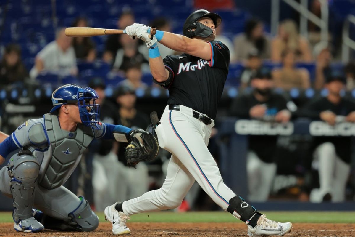 Jul 18, 2025; Miami, Florida, USA; Miami Marlins left fielder Kyle Stowers (28) hits a two-run walk-off home run against the Kansas City Royals during the tenth inning at loanDepot Park. Mandatory Credit: Sam Navarro-Imagn Images