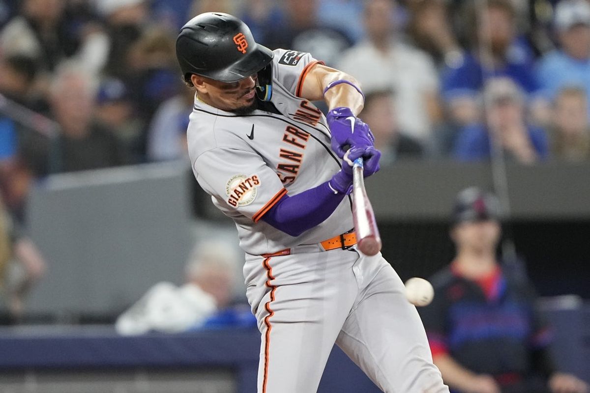 Jul 18, 2025; Toronto, Ontario, CAN; San Francisco Giants shortstop Willy Adames (2) hits a single against the Toronto Blue Jays during the eighth inning at Rogers Centre. Mandatory Credit: John E. Sokolowski-Imagn Images