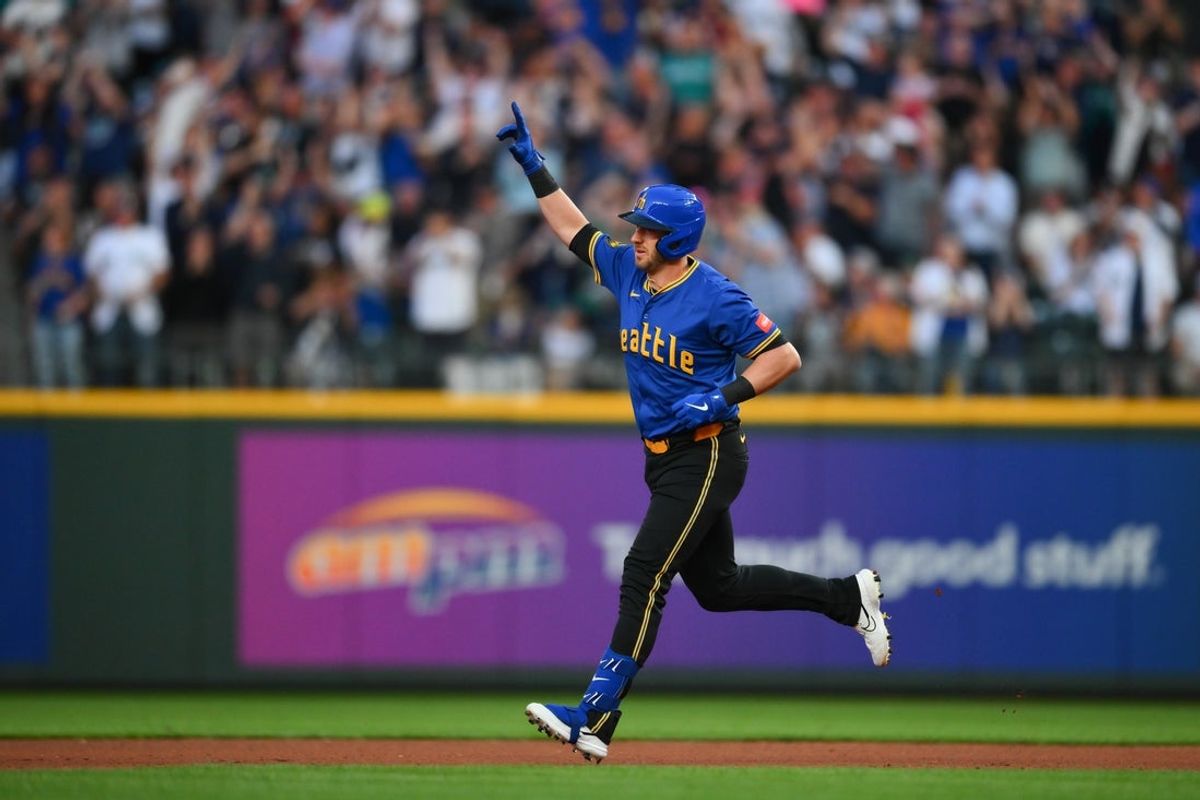 Jul 18, 2025; Seattle, Washington, USA; Seattle Mariners designated hitter Mitch Garver (18) runs the bases after hitting a home run against the Houston Astros during the seventh inning at T-Mobile Park. Mandatory Credit: Steven Bisig-Imagn Images