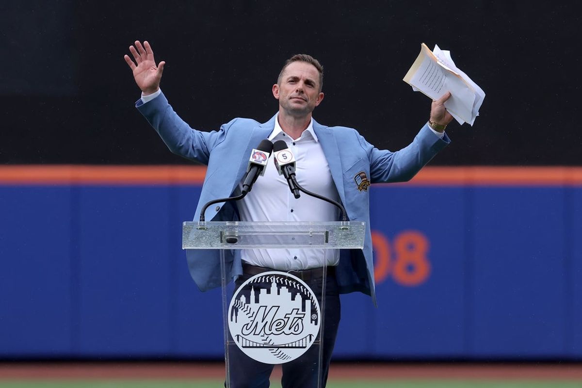 Jul 19, 2025; New York City, New York, USA; New York Mets former third baseman David Wright speaks to the crowd after his number was retired by the Mets before a game against the Cincinnati Reds at Citi Field. Mandatory Credit: Brad Penner-Imagn Images