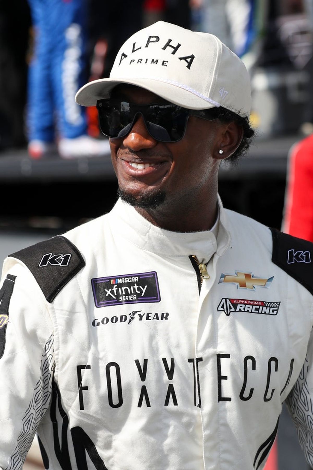 Jul 19, 2025; Dover, Delaware, USA; NASCAR Xfinity Series driver Lavar Scott looks on from pit road prior to the BetRivers 200 at Dover Motor Speedway. Mandatory Credit: Matthew O'Haren-Imagn Images