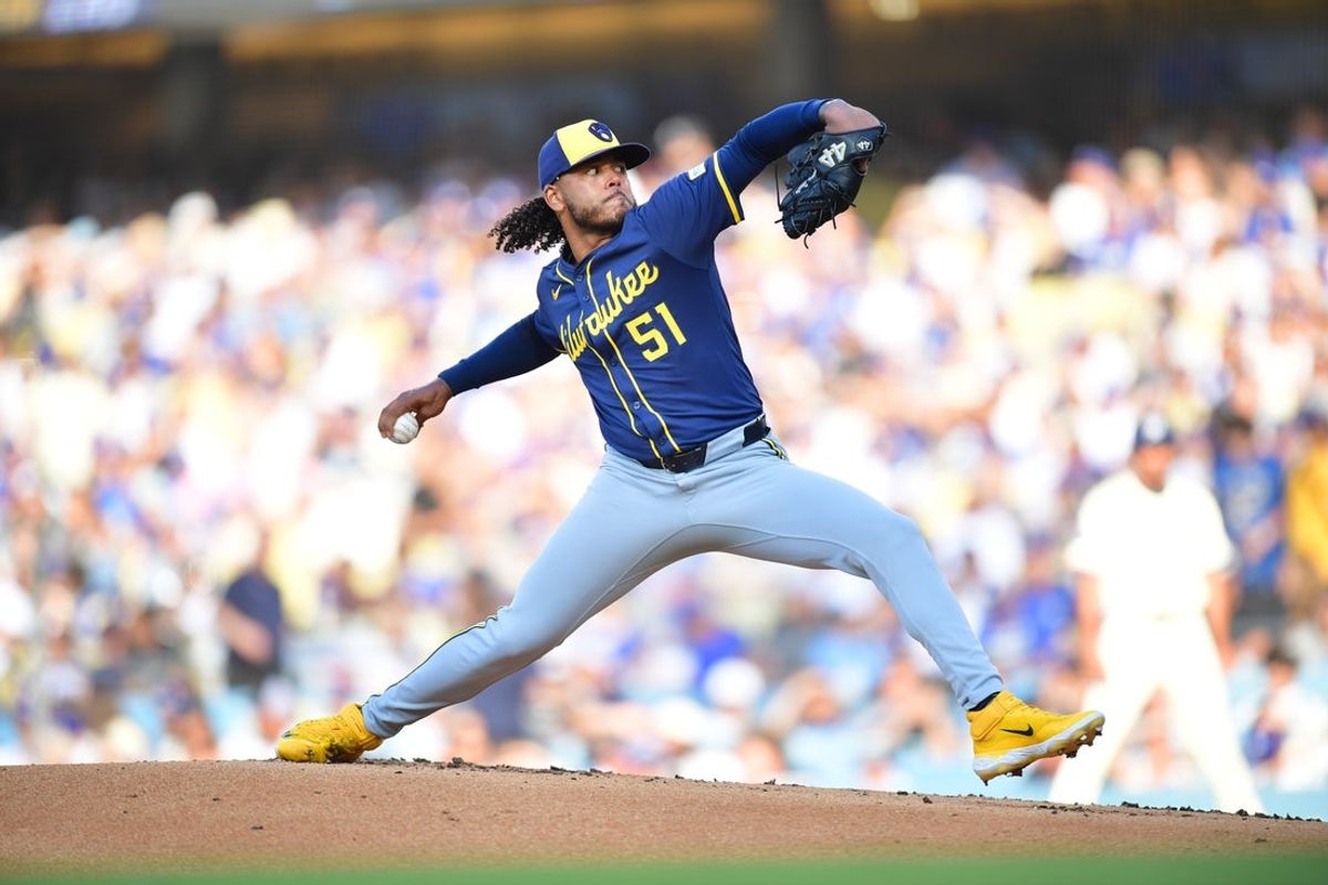 Jul 19, 2025; Los Angeles, California, USA; Milwaukee Brewers starting pitcher Freddy Peralta (51) throws during the first inning against the Los Angeles Dodgers at Dodger Stadium. Mandatory Credit: Gary A. Vasquez-Imagn Images