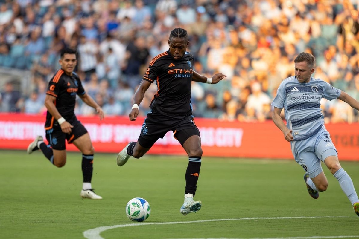 Jul 19, 2025; Kansas City, Kansas, USA; New York City FC midfielder Andres Perea (8) shoots a goal during the first half of the game against Sporting Kansas City at Children's Mercy Park. Mandatory Credit: Kylie Graham-Imagn Images