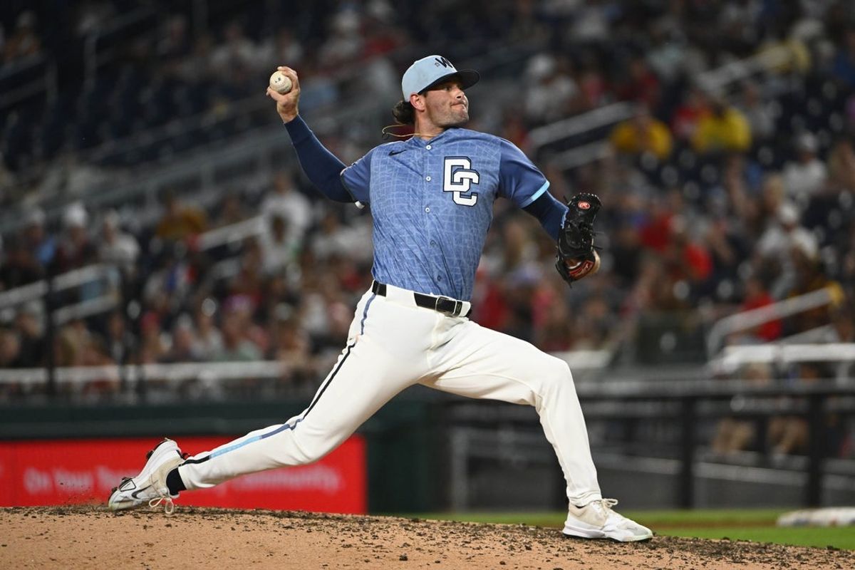 Jul 19, 2025; Washington, District of Columbia, USA; Washington Nationals relief pitcher Kyle Finnegan (67) throws to the San Diego Padres during the ninth inning at Nationals Park. Mandatory Credit: Brad Mills-Imagn Images