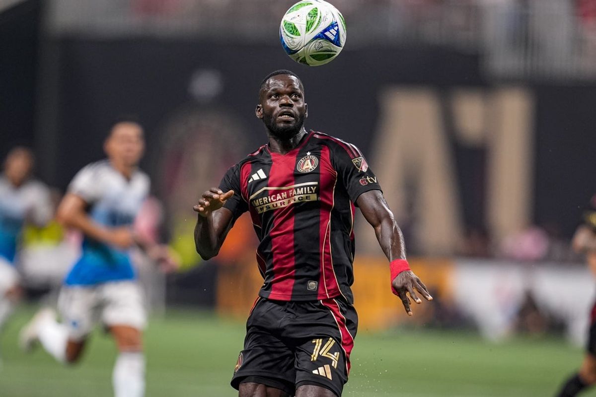 Jul 19, 2025; Atlanta, Georgia, USA; Atlanta United forward Jamal Thiare (14) makes a play on the ball against Charlotte FC during the second half at Mercedes-Benz Stadium. Mandatory Credit: Dale Zanine-Imagn Images
