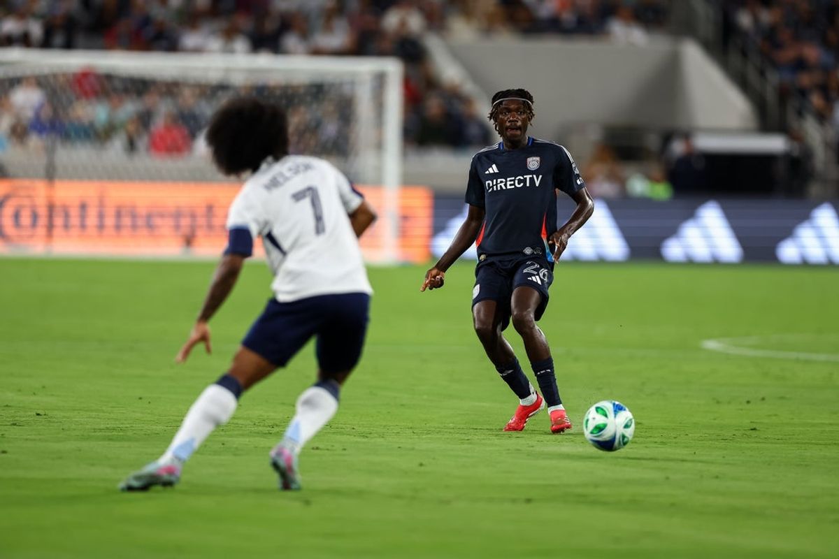 Jul 19, 2025; San Diego, California, USA; San Diego FC midfielder Manu Duah (26) looks to pass during the first half against the Vancouver Whitecaps at Snapdragon Stadium. Mandatory Credit: Chadd Cady-Imagn Images