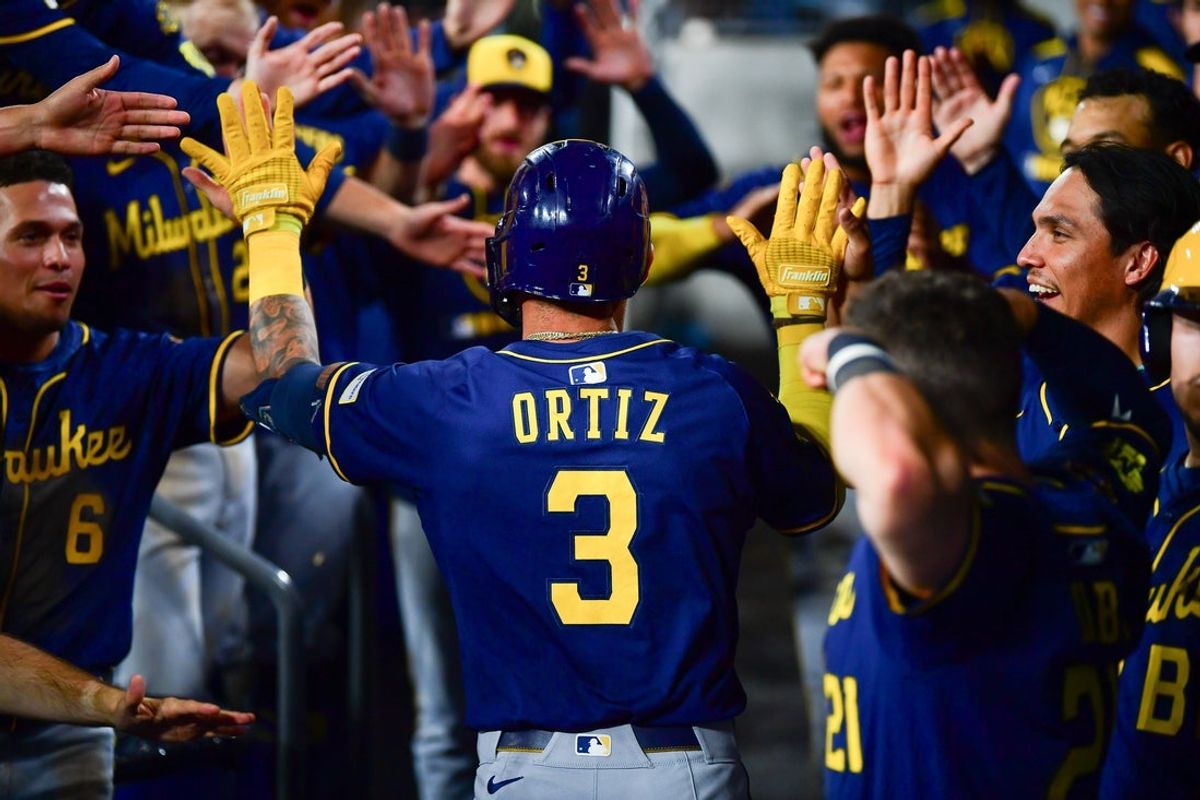 Jul 19, 2025; Los Angeles, California, USA; Milwaukee Brewers shortstop Joey Ortiz (3) celebrates after hitting a solo home run against the Los Angeles Dodgers during the eighth inning at Dodger Stadium. Mandatory Credit: Gary A. Vasquez-Imagn Images
