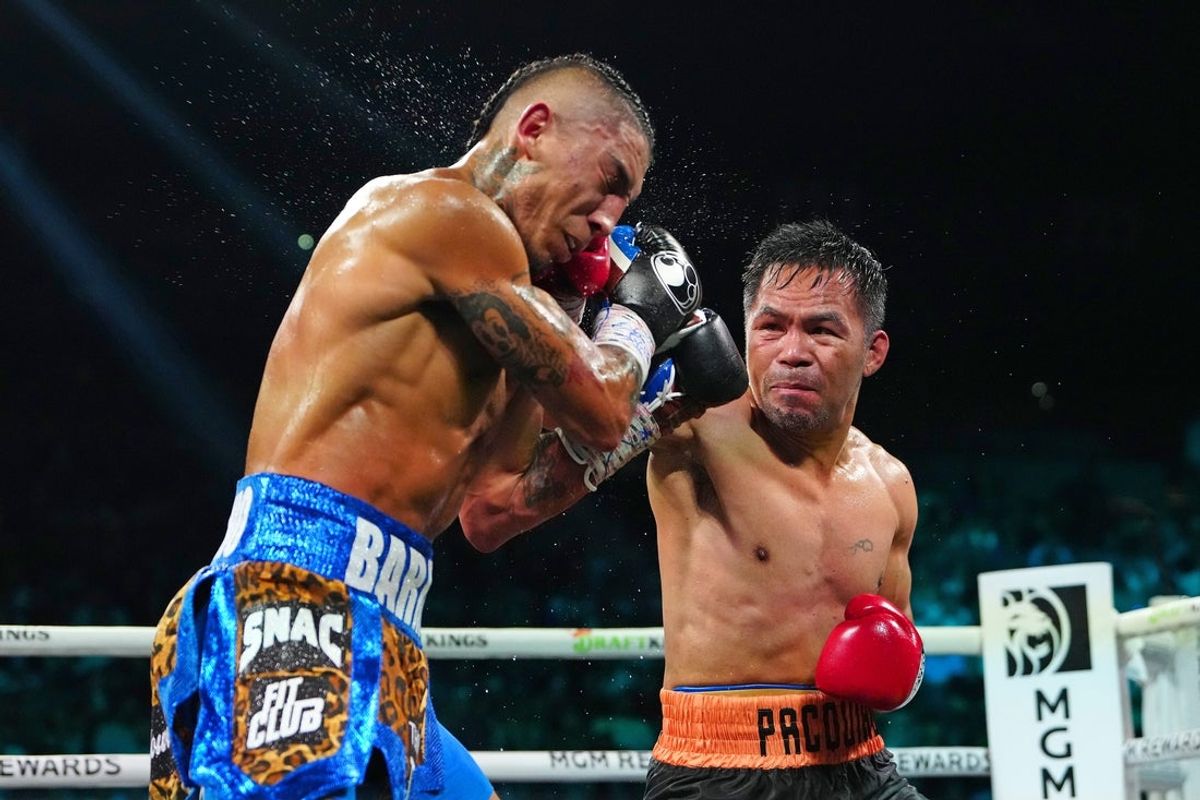 Jul 19, 2025; Las Vegas, Nevada,  USA; Manny Pacquiao fights Mario Barrios at MGM Grand Garden Arena. Mandatory Credit: Stephen R. Sylvanie-Imagn Images