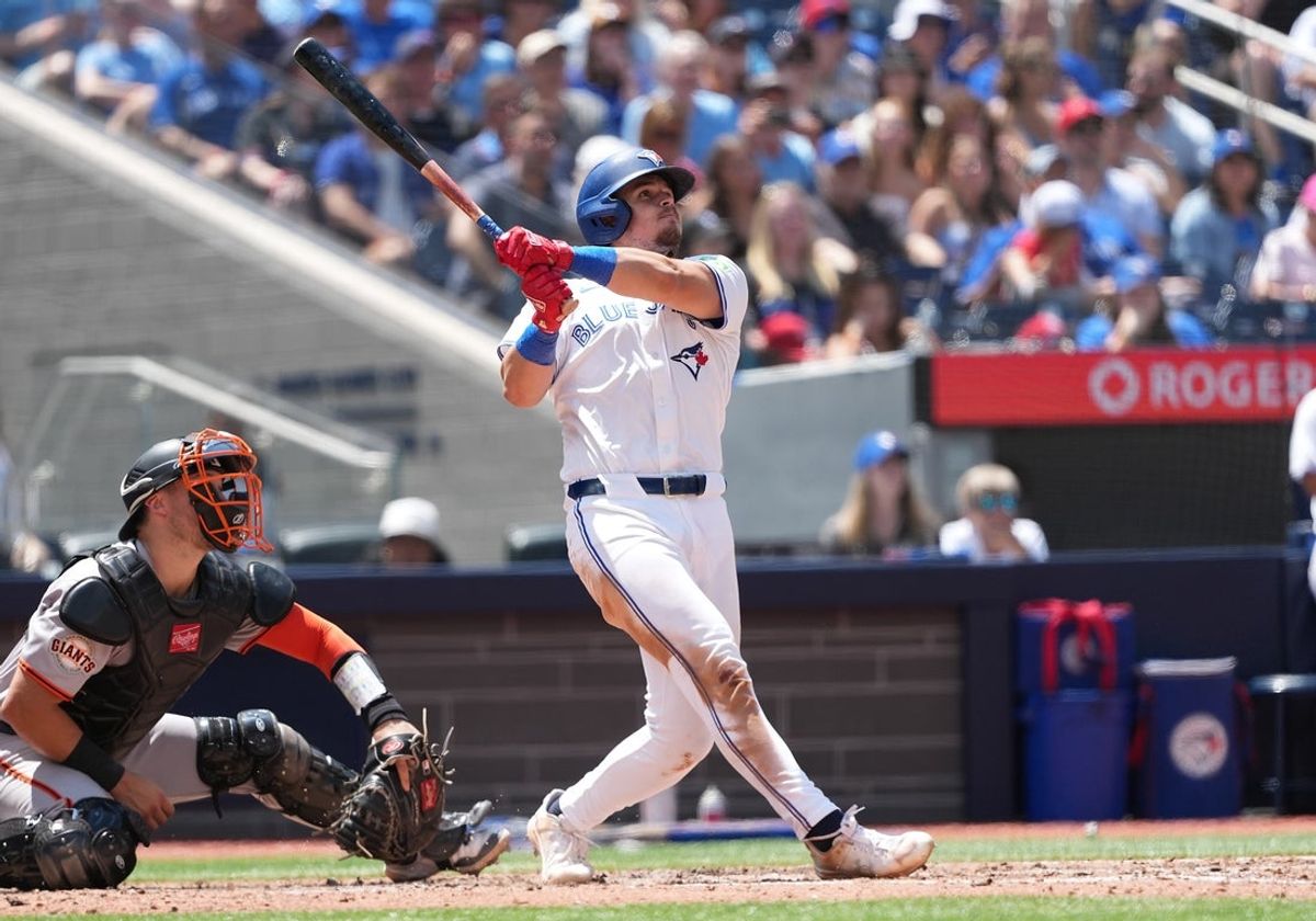 Jul 20, 2025; Toronto, Ontario, CAN; Toronto Blue Jays right fielder Addison Barger (47) hits a two run home run against the San Francisco Giants during the fifth inning at Rogers Centre. Mandatory Credit: Nick Turchiaro-Imagn Images