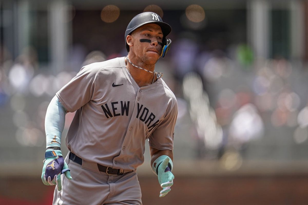 Jul 20, 2025; Cumberland, Georgia, USA; New York Yankees right fielder Aaron Judge (99) runs after hitting a home run against the Atlanta Braves during the first inning at Truist Park. Mandatory Credit: Dale Zanine-Imagn Images