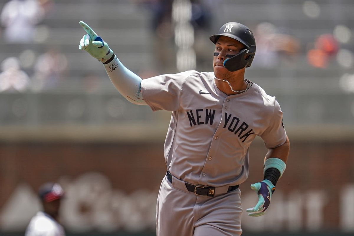 Jul 20, 2025; Cumberland, Georgia, USA; New York Yankees right fielder Aaron Judge (99) runs after hitting a home run against the Atlanta Braves during the first inning at Truist Park. Mandatory Credit: Dale Zanine-Imagn Images