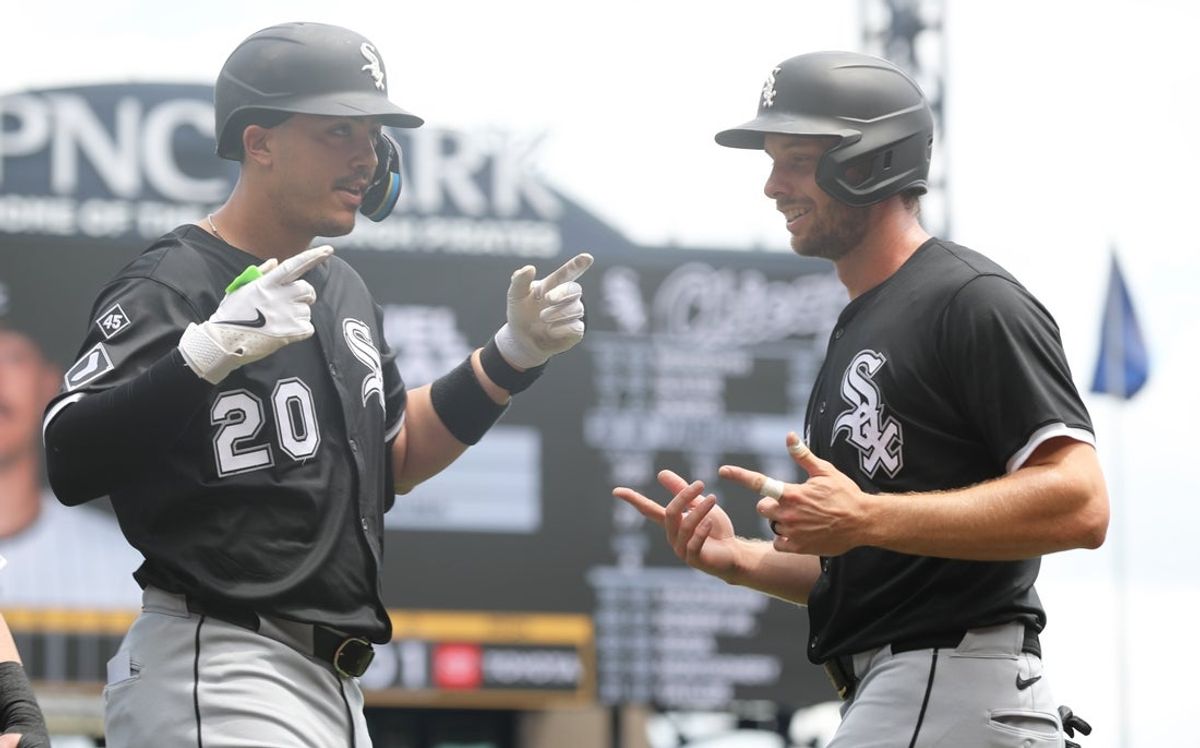 Jul 20, 2025; Pittsburgh, Pennsylvania, USA;  Chicago White Sox first baseman Miguel Vargas (20) celebrates his three run home run with right fielder Austin Slater (15) against the Pittsburgh Pirates during the first inning at PNC Park. Mandatory Credit: Charles LeClaire-Imagn Images