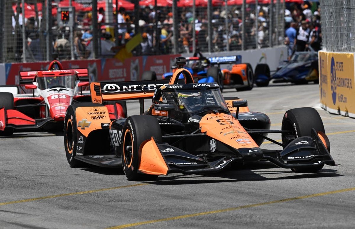 Jul 20, 2025; Toronto, Ontario, CAN;  Indycar driver Pato O'Ward (5) leads the field as he drives to victory during the Ontario Honda Dealers Indy at Streets of Toronto. Mandatory Credit: Dan Hamilton-Imagn Images