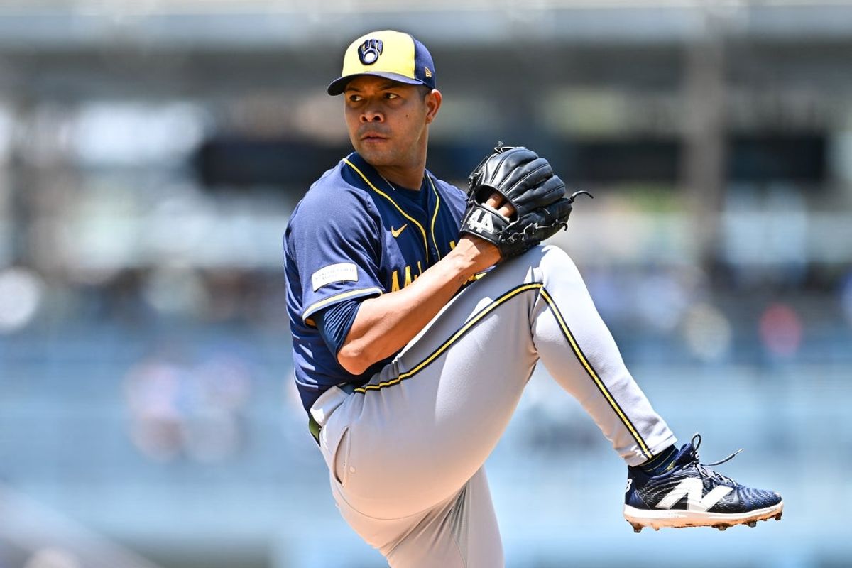 Jul 20, 2025; Los Angeles, California, USA; Milwaukee Brewers starting pitcher Jose Quintana (62) throws a pitch against the Los Angeles Dodgers during the first inning of the game at Dodger Stadium. Mandatory Credit: Jonathan Hui-Imagn Images