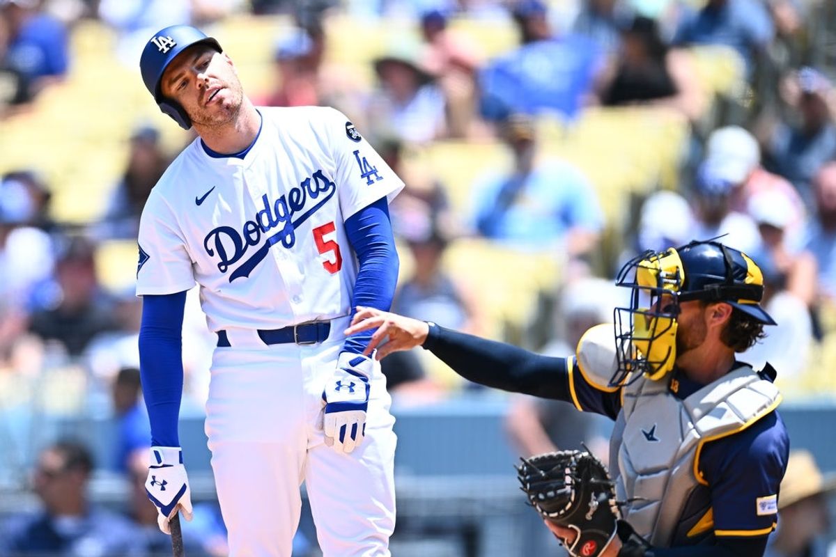 Jul 20, 2025; Los Angeles, California, USA; Los Angeles Dodgers first baseman Freddie Freeman (5) reacts to striking out against the Milwaukee Brewers during the second inning of the game at Dodger Stadium. Mandatory Credit: Jonathan Hui-Imagn Images