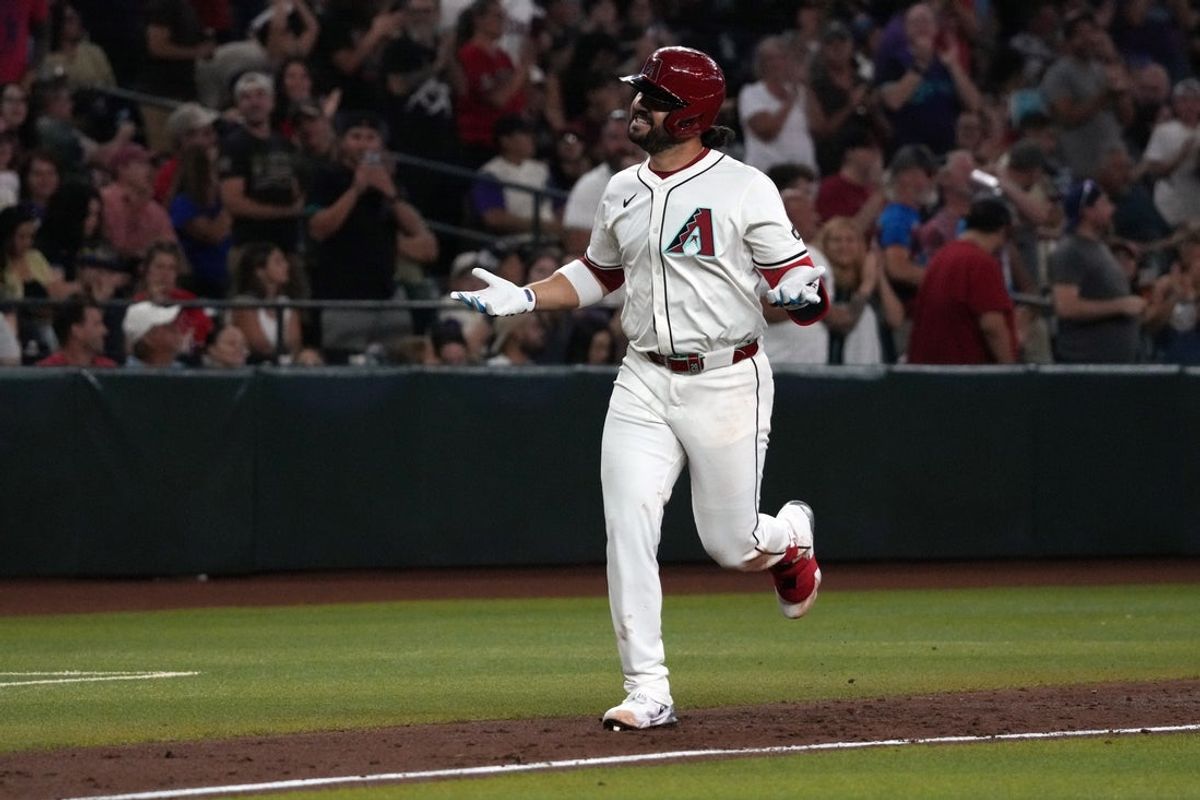 Jul 19, 2025; Phoenix, Arizona, USA; Arizona Diamondbacks third base Eugenio Suárez (28) reacts after hitting a solo home run against the St. Louis Cardinals in the third inning at Chase Field. Mandatory Credit: Rick Scuteri-Imagn Images