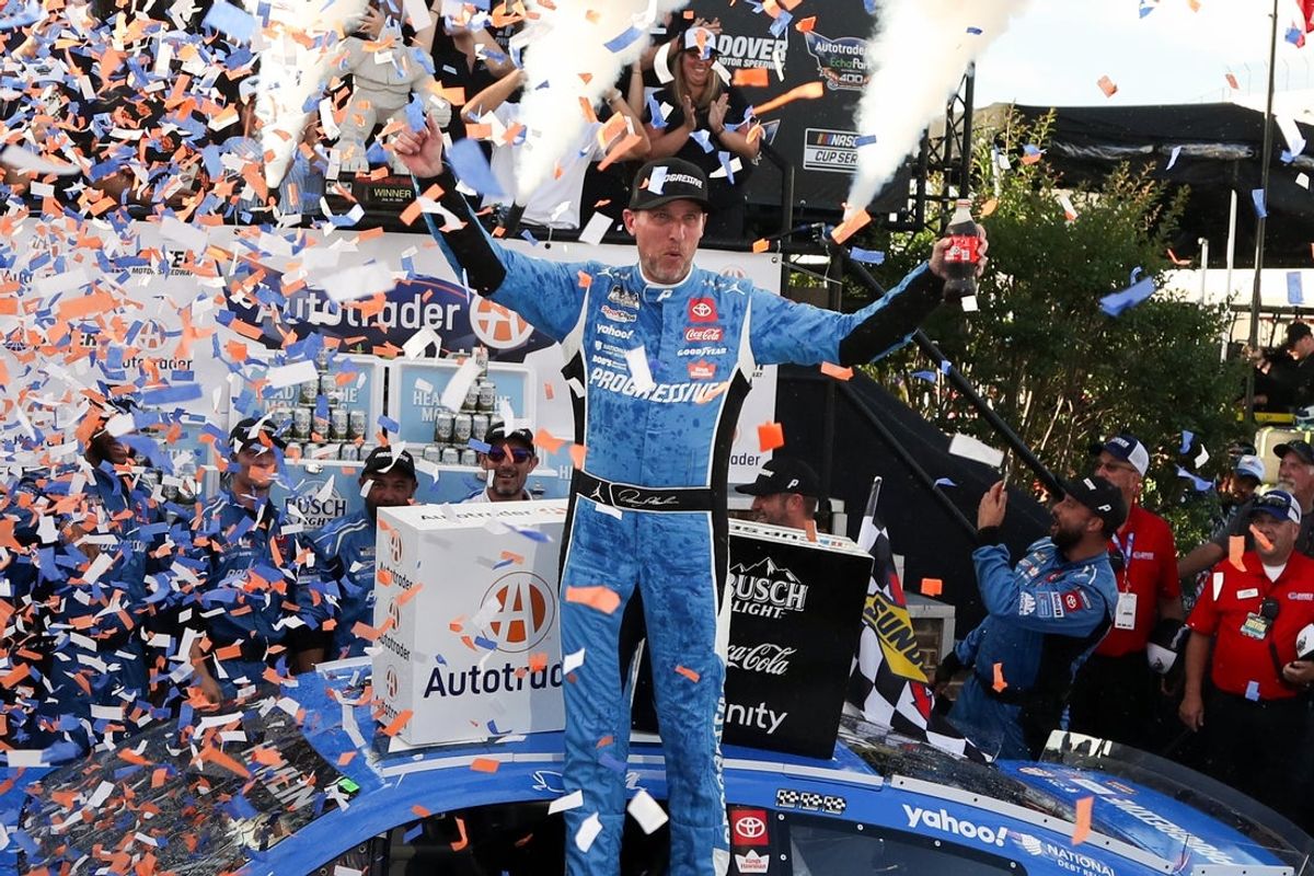 Jul 20, 2025; Dover, Delaware, USA; NASCAR Cup Series driver Denny Hamlin celebrates in victory lane after winning the Autotrader EchoPark Automotive 400 at Dover Motor Speedway. Mandatory Credit: Matthew O'Haren-Imagn Images
