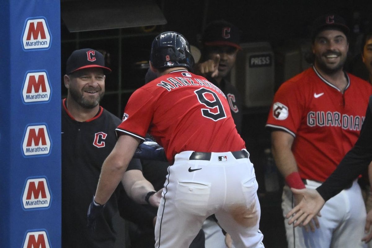 Jul 21, 2025; Cleveland, Ohio, USA; Cleveland Guardians designated hitter Kyle Manzardo (9) celebrates his solo home run with manager Stephen Vogt (12) in the sixth inning against the Baltimore Orioles at Progressive Field. Mandatory Credit: David Richard-Imagn Images