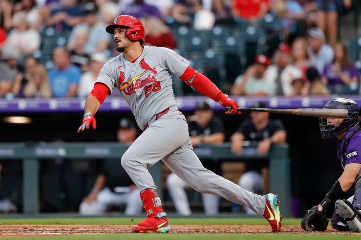 Jul 21, 2025; Denver, Colorado, USA; St. Louis Cardinals third baseman Nolan Arenado (28) hits a single in the sixth inning against the Colorado Rockies at Coors Field. Mandatory Credit: Isaiah J. Downing-Imagn Images