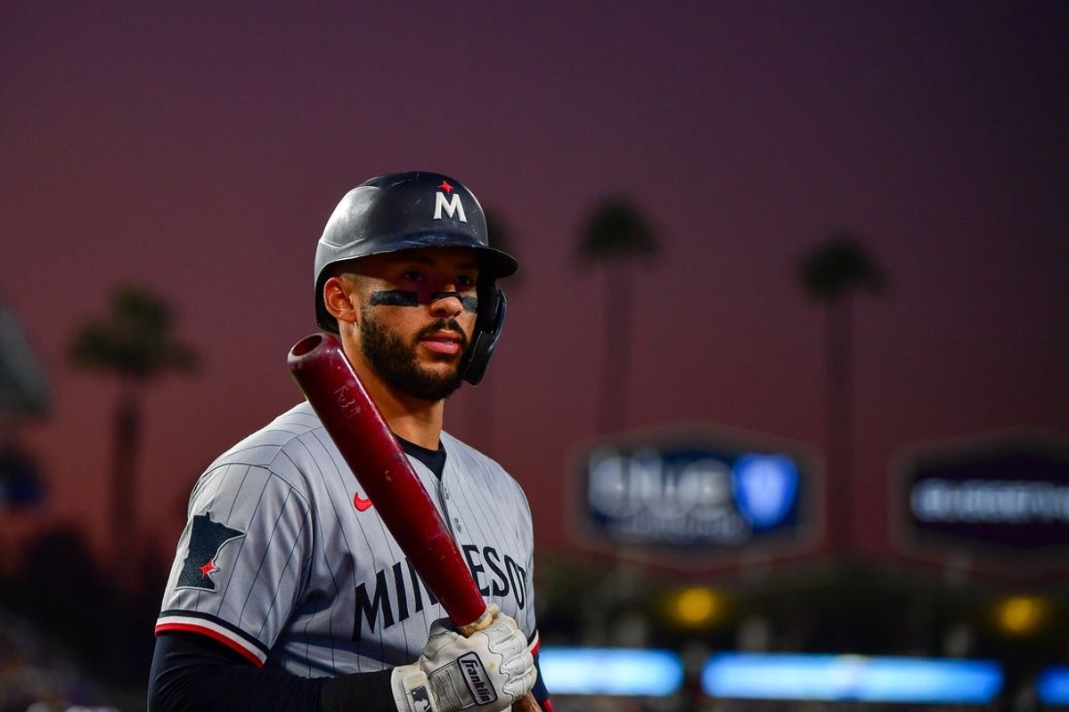 Jul 21, 2025; Los Angeles, California, USA; Minnesota Twins shortstop Carlos Correa (4) on deck during the fifth inning at Dodger Stadium. Mandatory Credit: Gary A. Vasquez-Imagn Images