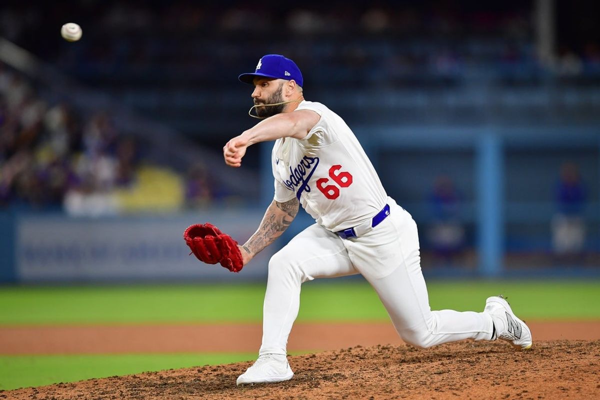 Jul 21, 2025; Los Angeles, California, USA; Los Angeles Dodgers pitcher Tanner Scott (66) throws against the Minnesota Twins during the eighth inning at Dodger Stadium. Mandatory Credit: Gary A. Vasquez-Imagn Images